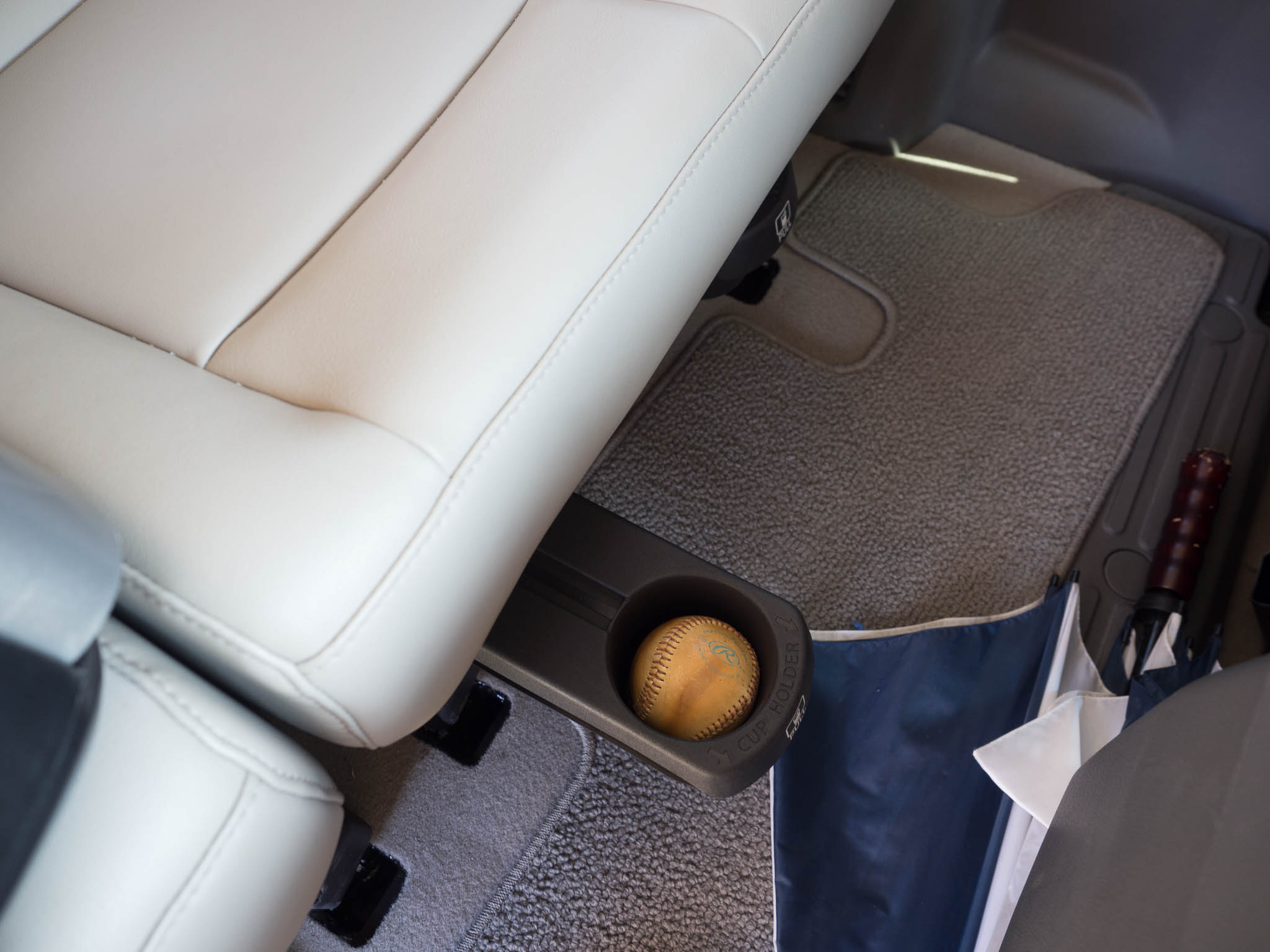 Seat mounted cupholders are perfect for holding beverages, or ... baseballs.